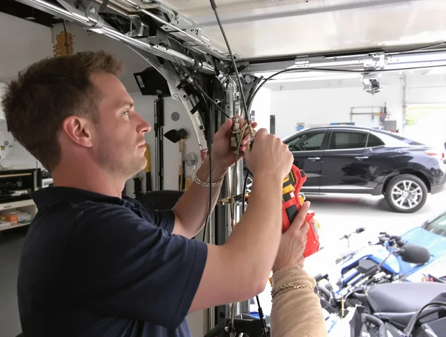 Plainville Garage Door Repair safety certified technician performing cable replacement in Plainville