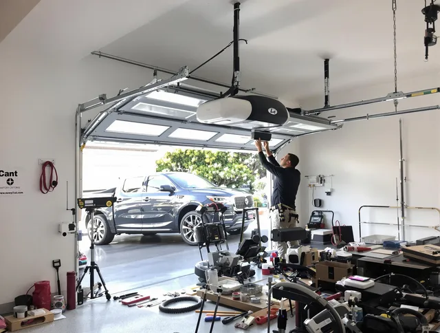 Plainville Garage Door Repair specialist installing smart garage door opener system in Plainville home