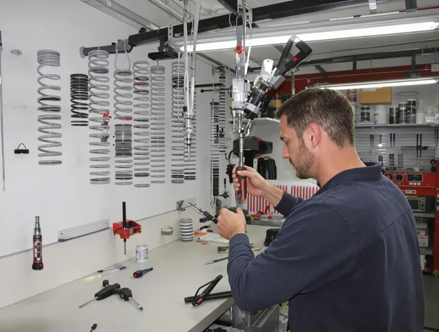 Plainville Garage Door Repair safety certified technician performing precision spring replacement in Plainville